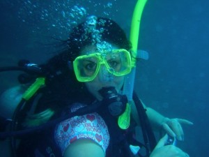 scuba diving Mel poses while scuba diving